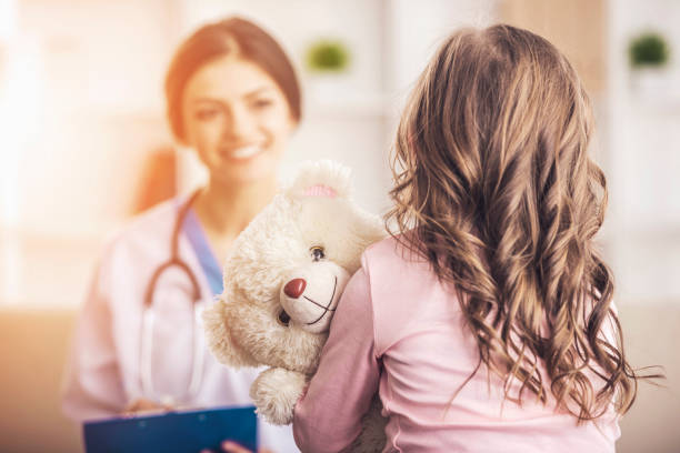 istock Little girl in a doctor 933438886