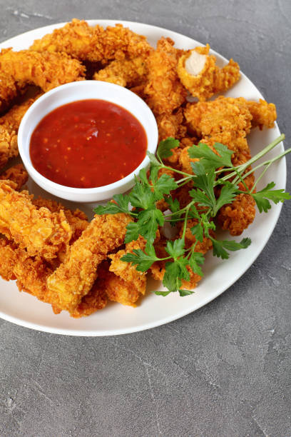 istock tasty crispy fried chicken breast strips 933439808