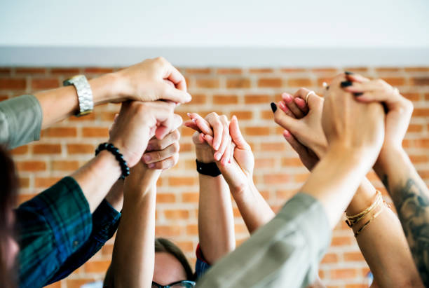 istock Business team raising their hands up to celebrate 933443082