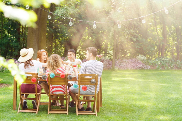 istock Smiling friends during garden party 933445796