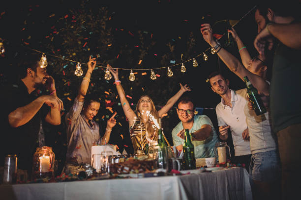 istock Happy friends having fun at backyard birthday party 933453554