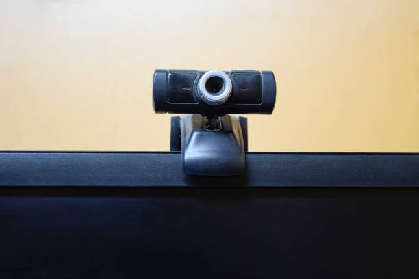 istock Web camera, attached to the monitor. Equipment for video 933453930