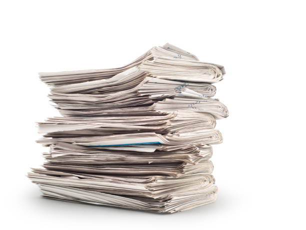istock A stack of old newspapers isolated on white background 933454588