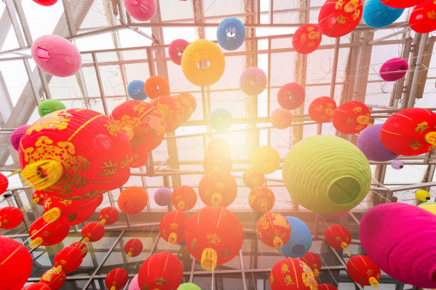 istock Colorful folding paper lantern on ceiling with Light fair,Chinese new year 933455060