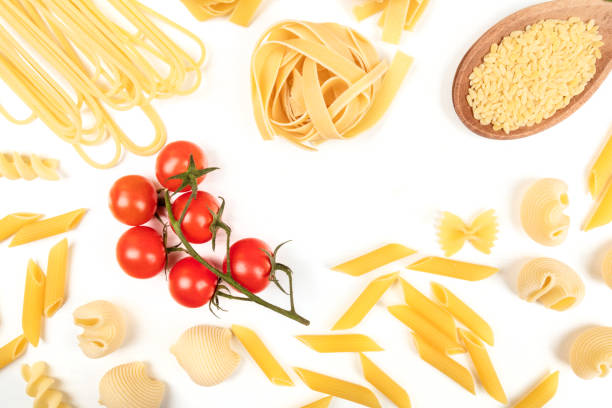 istock Overhead photo of different types of pasta on white with copy space 933457702