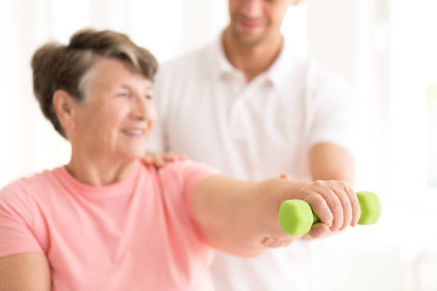istock Senior woman exercising with dumbbell 933458006