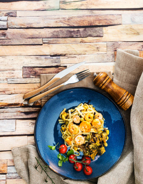 istock Cooked pasta with peeled shrimp, coconut milk sauce and broccoli 933458128