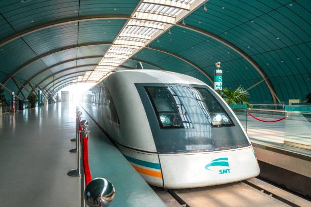 Shanghai Maglev Train in station, China A Transrapid high speed train stands at Longyang Lu station in Shanghai, China.The Shanghai Maglev train is a magnetic levitation train and reach up to a speed of 431km/h. This image is GPS tagged maglev train stock pictures, royalty-free photos & images