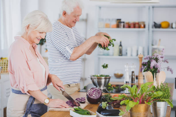 istock Elderly preparing healthy meal together 933461762