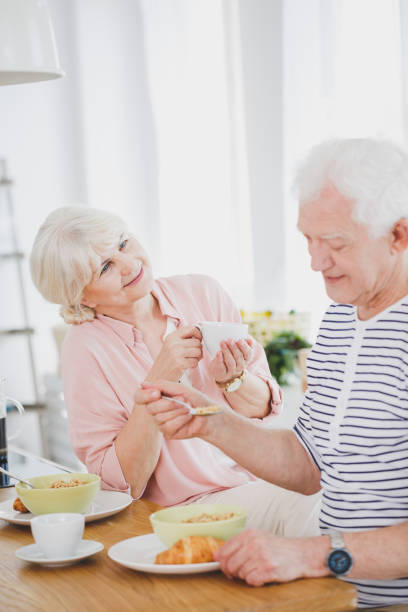 istock Wife looking at husband eating 933461778