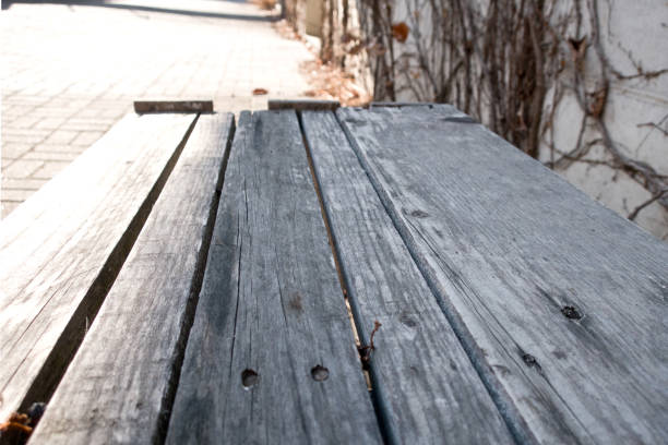 istock Old wooden decking or flooring isolated on blank grey space 933462060