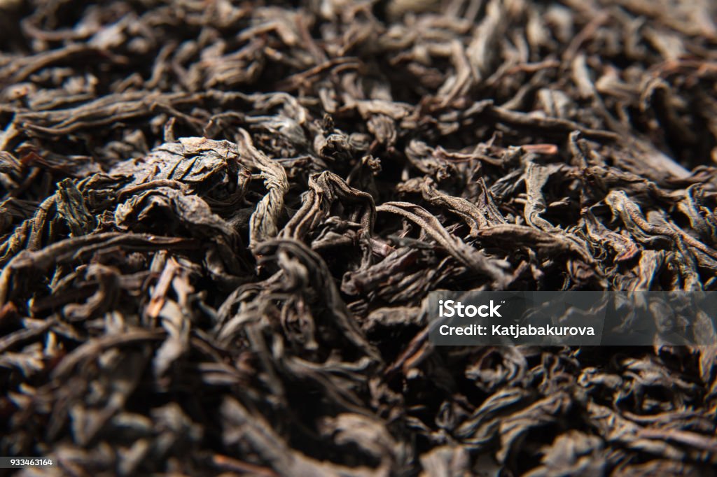 Dried leaves of black tea background. Macro photo - top view Agriculture Stock Photo