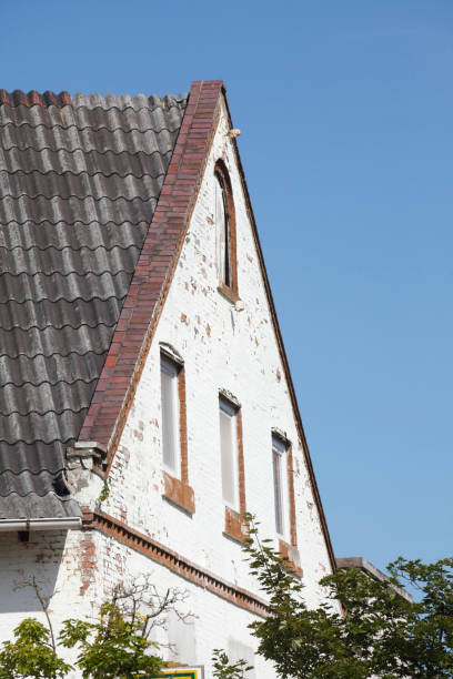 istock Roof gable, old dilapidated apartment building 933465916