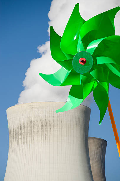 di energia - wind power toy symbol cooling tower foto e immagini stock