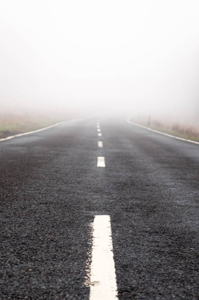 istock Foggy country road 933469758