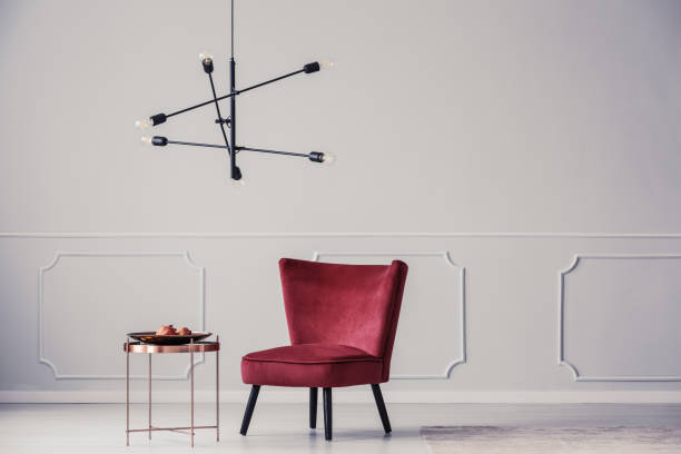istock Red armchair in bright apartment 933471228