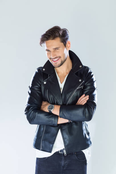 istock Portrait of smiling handsome man wearing leather jacket 933474474