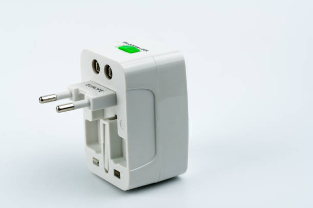 istock Universal plug adapters for travel around the world isolated on white background. 933474578