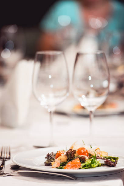 istock delicious salmon salad in a restaurant. small portion 933478834