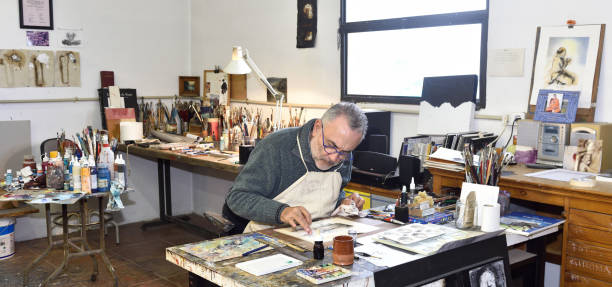 Painter artist painting a picture in the studio