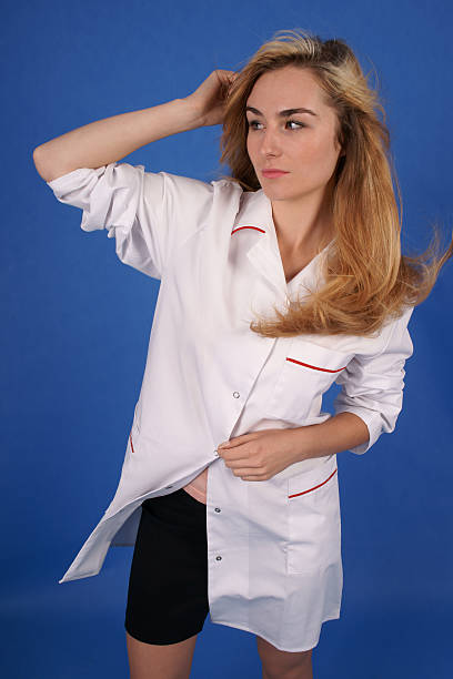 Fashion shoot of doctor in medical coat stock photo