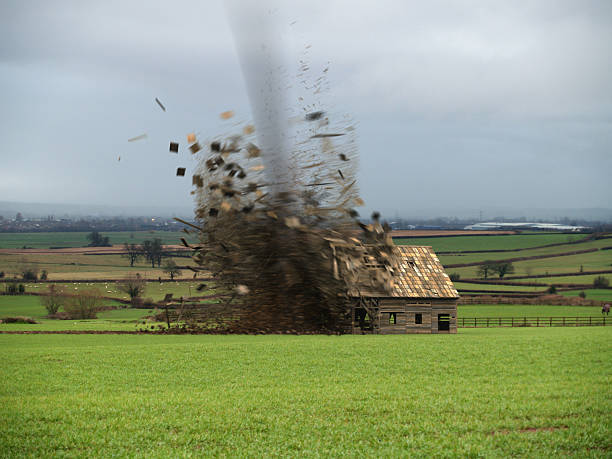 Tornado Destroying Barn  tornado stock pictures, royalty-free photos & images