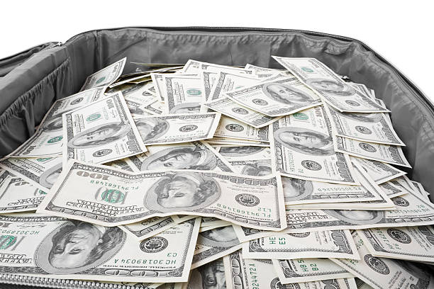 istock lot of money in a suitcase 93350152