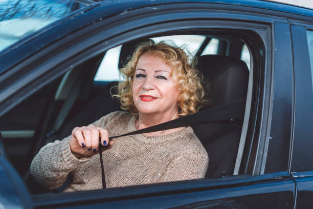 istock Senior lady in her car 933502094