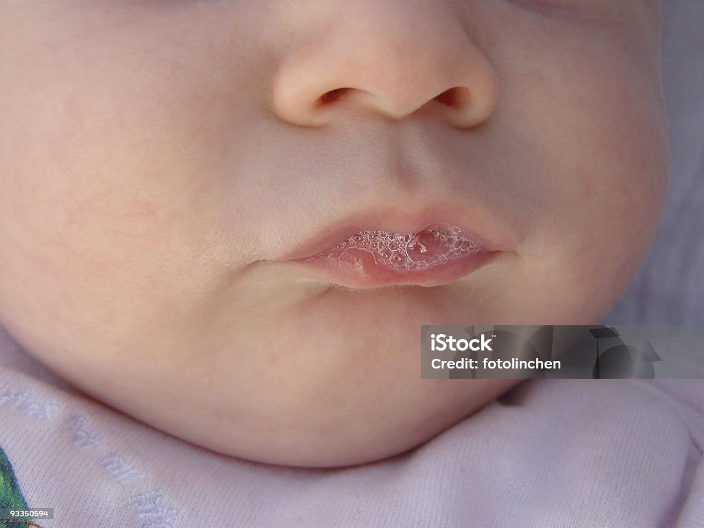 Blubber-Baby 3 month old baby in the bubble production. In the bubbles reflects the grandma and the photographer. Baby - Human Age Stock Photo