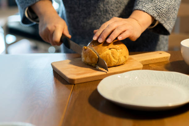 istock cutting homemade bun to slices 933516544