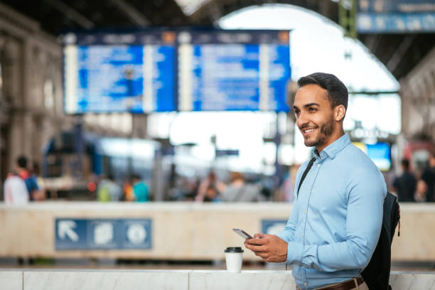 istock Smiling person going to business trip by train 933528376