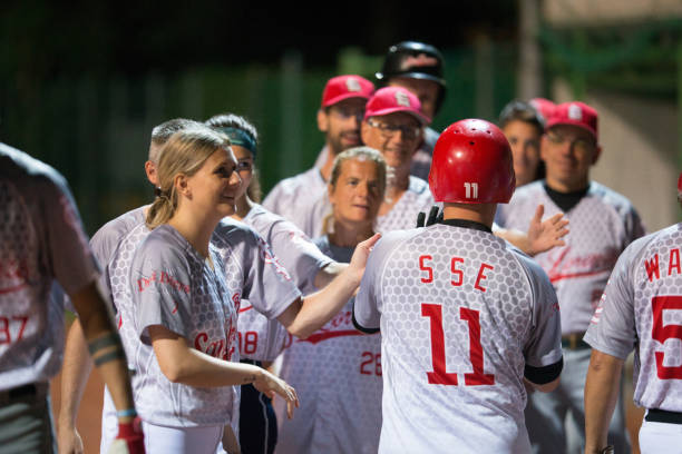 istock Softball Players Greeting Their Teammate 933528402
