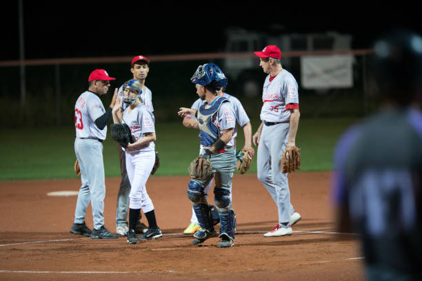 istock Softball Players Talking to Each Other 933528426