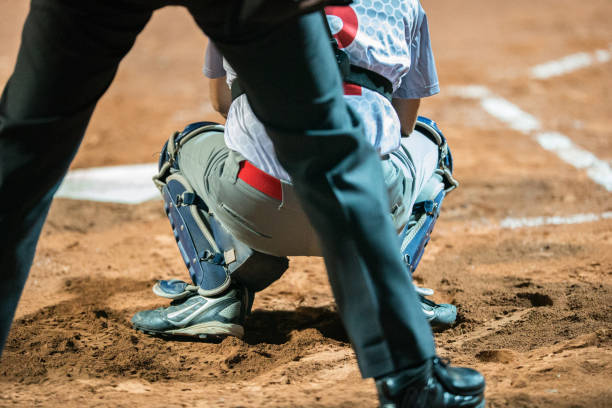 istock Rear View of Softball Catcher 933528802