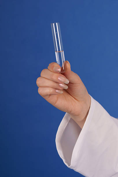 Doctor hand with test tube stock photo