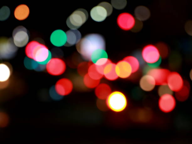 istock Colorful defocused bokeh lights in blur night background 933545876