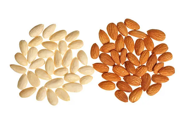 Two piles of almonds isolated on white