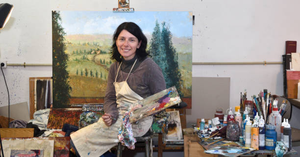 istock woman painting in a painting studio 933557780