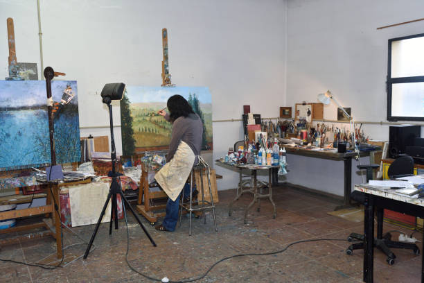istock woman painting in a painting studio 933557944