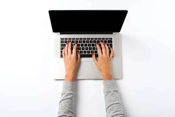 istock Female hands working on modern laptop. Office desktop 933579344