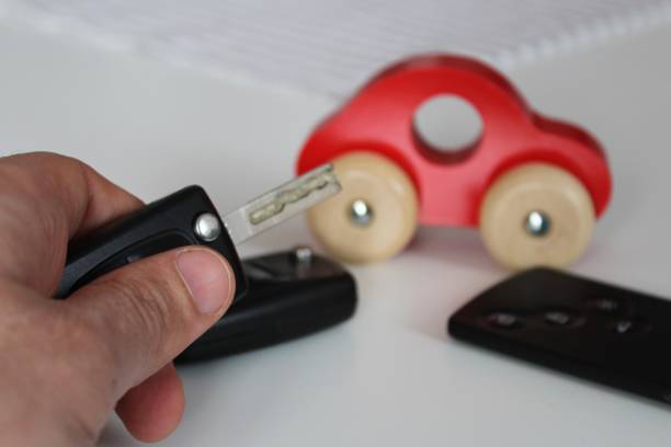 istock Car key in male hand. 933579498