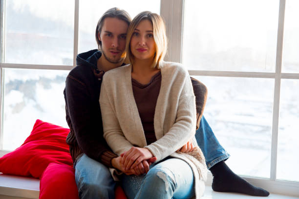 istock Couple cuddling together 933579508