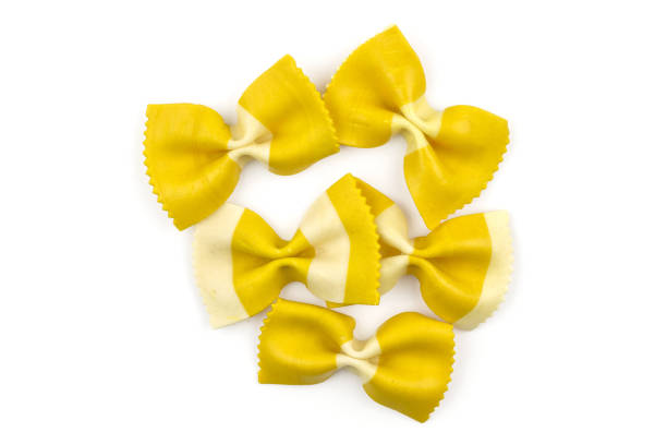 istock Colourful raw farfalle isolated on white 933583204