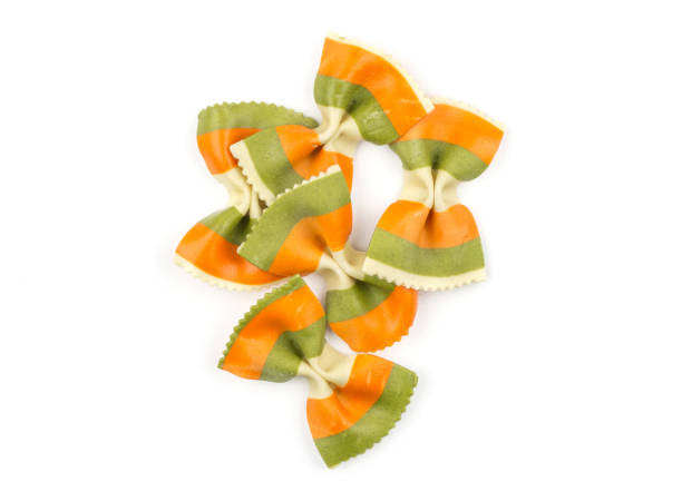 istock Colourful raw farfalle isolated on white 933583244