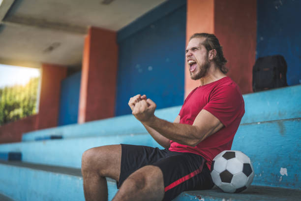 istock Fan watching a soccer game 933586362