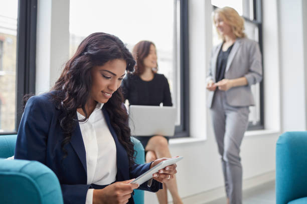 istock Businesswoman using digital tablet in office 933590948