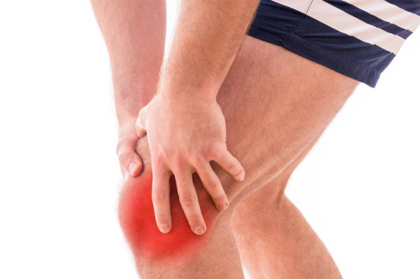 istock Man with knee pain over white background 933596012