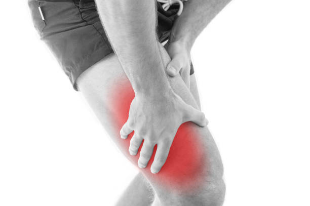 istock Man with quadriceps pain over white background 933598418