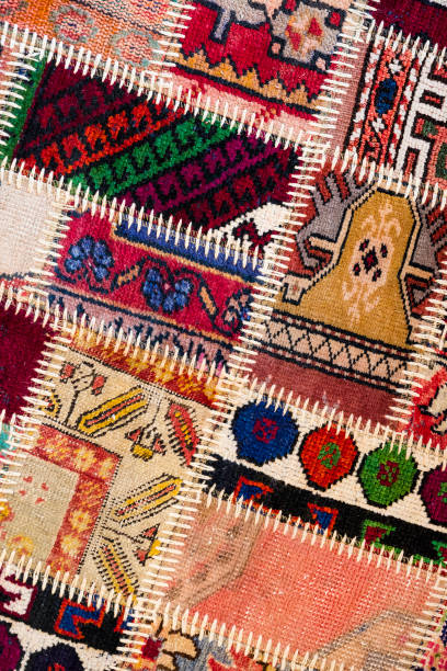 istock Background of an old worn carpet sewn 933599556