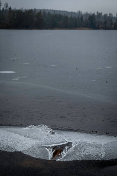 istock hole in the ice on a small lake 933603186